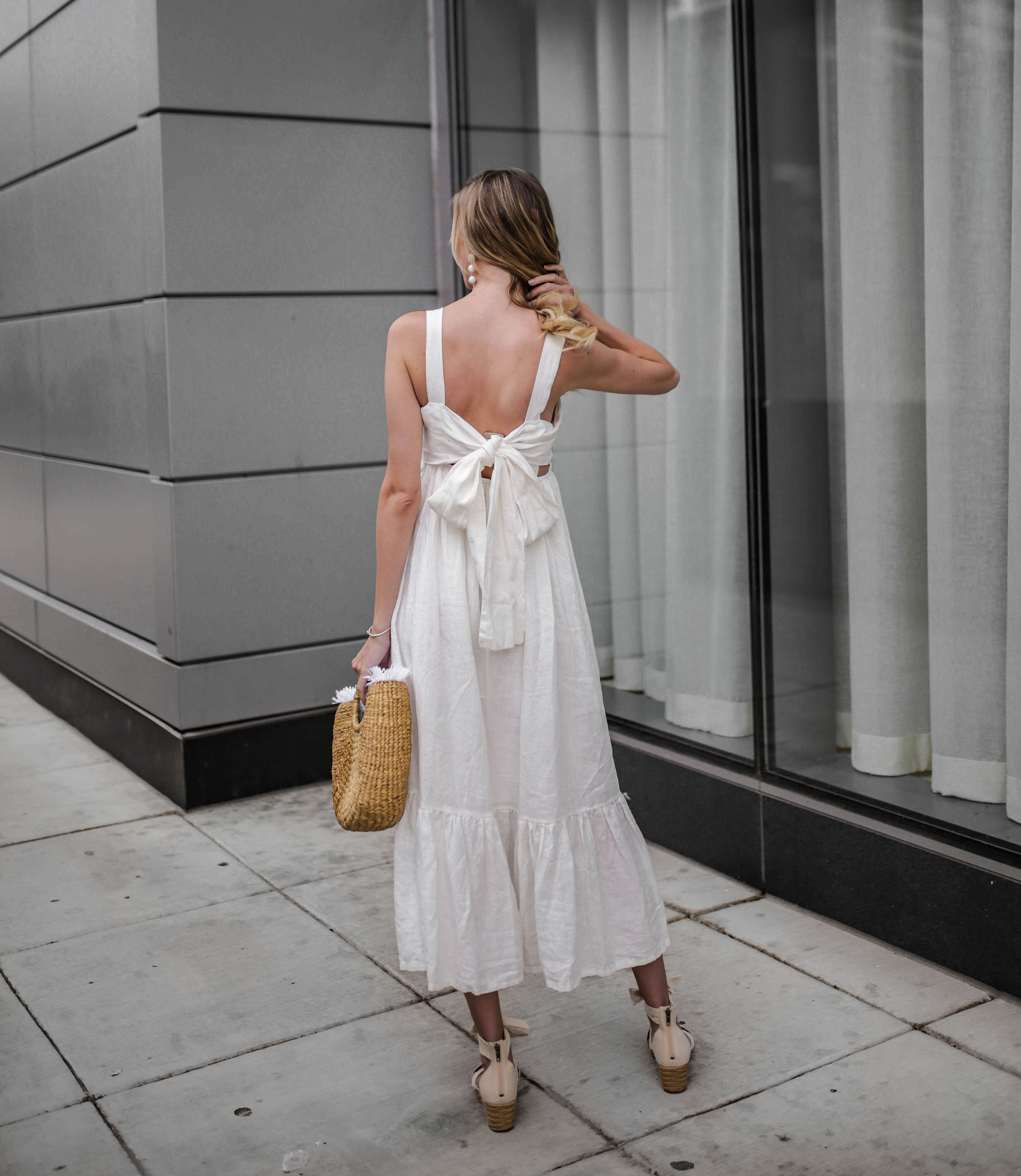 Carly Cristman wearing a summer linen dress with wedges, Summer Trends 2018, CAARA Forget Me Not Linen Midi Dress, UGG Traci Espadrille Wedge Sandal, basket bag