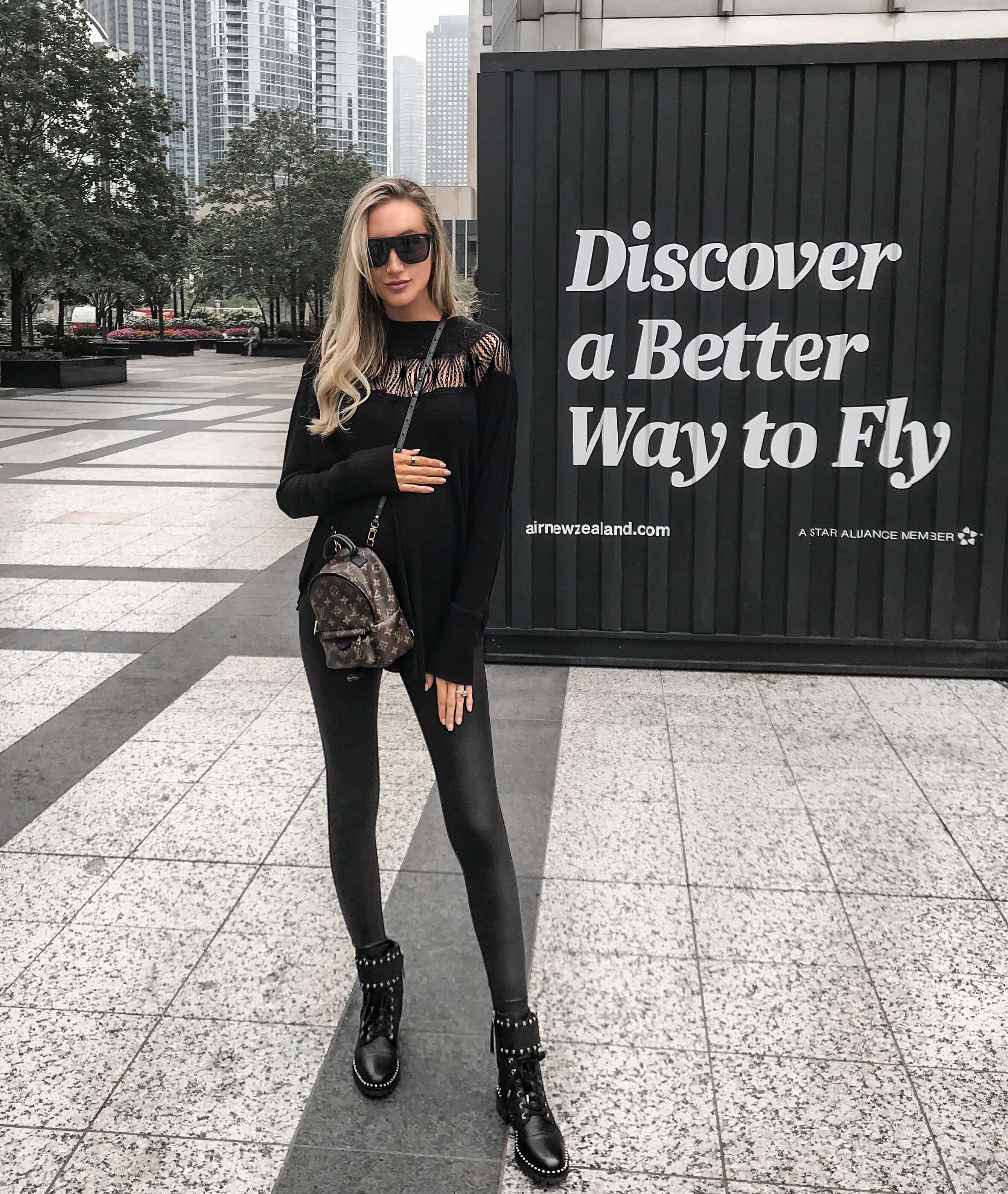Carly Cristman wearing Sam Edelman Jennifer Studded Combat Boots with Louis Vuitton mini backpack in Chicago, chicago streetstyle, stylish maternity outfit, chic maternity outfit